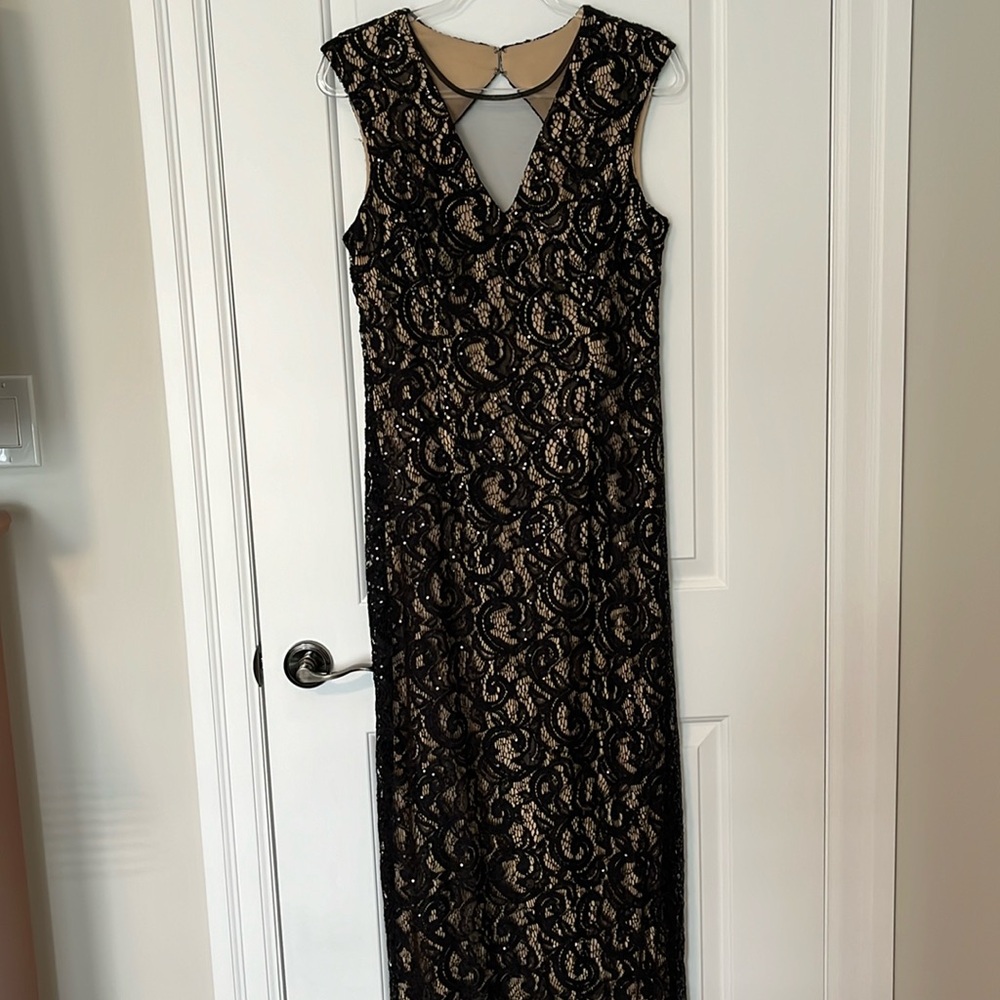 Size 12 sequined long evening gown, mesh in front and small peek a boo in back.